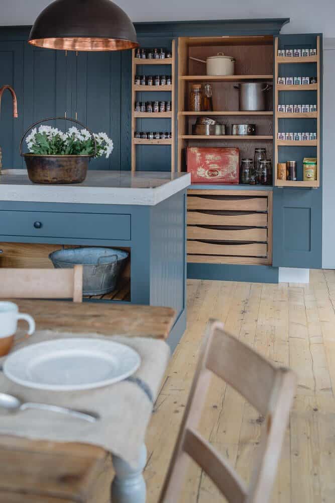 Sustainable Kitchens Showroom with tall larder storage cabinet and internal spice racks