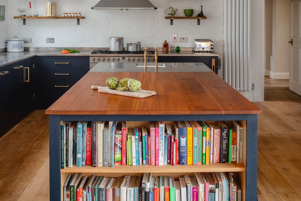 Eco Extension Shaker Kitchen cookery books and vegetables on a reclaimed wooden worktop